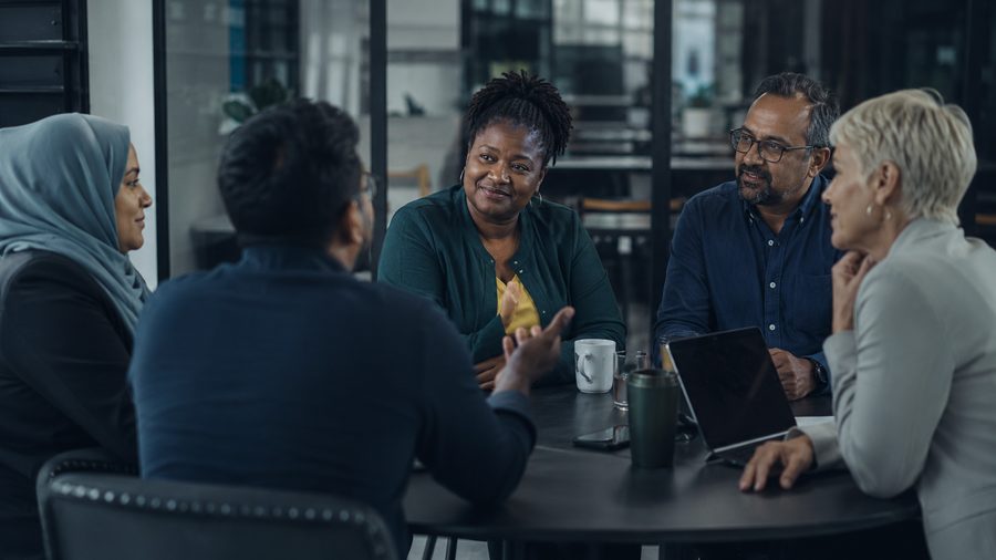 A diverse roundtable in easy, open conversation