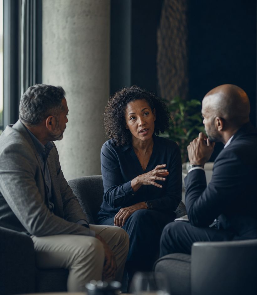 Senior leaders in focused strategic discussion